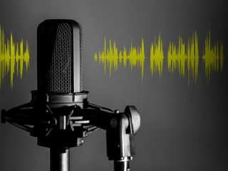 Professional,Microphone,With,Yellow,Voice,Waveform,On,Dark,Background,,Sound