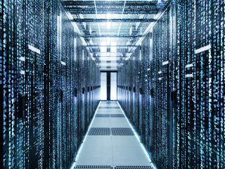 Shot,Of,Corridor,In,Working,Data,Center,Full,Of,Rack