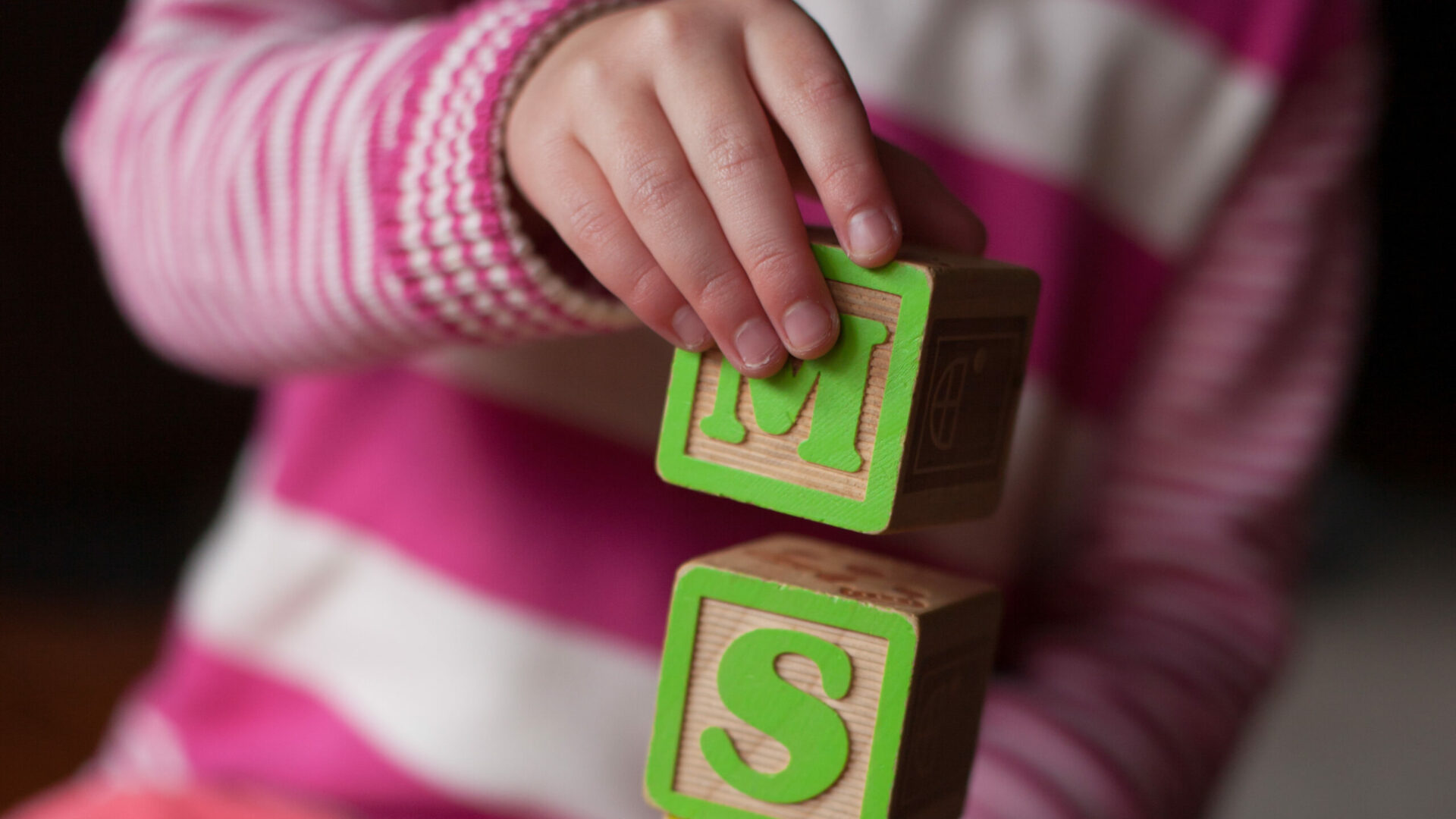 Child,Playing,With,Wooden,Alphabet,Blocks,Making,Ms,Word