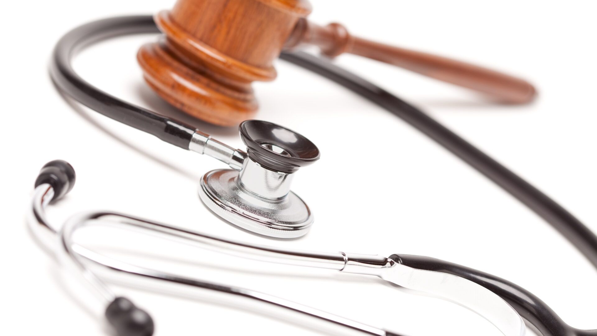 Black,Stethoscope,And,Gavel,Isolated,On,A,White,Background.